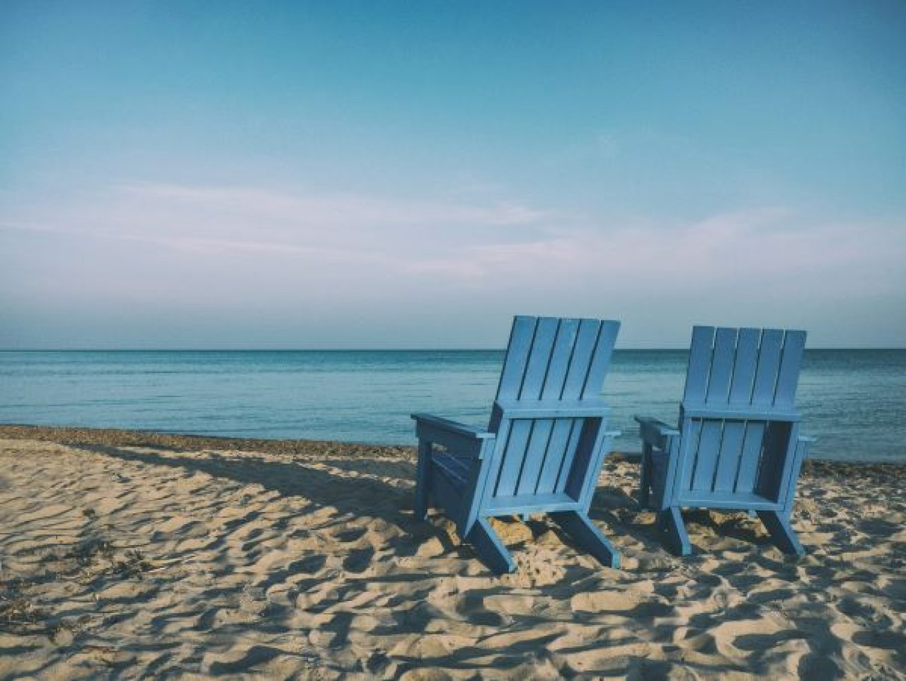 Deck Chairs on Beach.